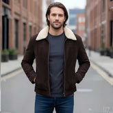 Man wearing brown suede sherpa jacket with jeans