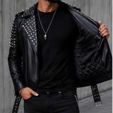 Close-up of silver-tone studs and spikes on black leather jacket and inner side