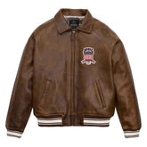 Brown leather jacket with a logo on the chest against a white background