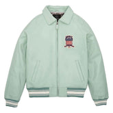 A mint green zip-up jacket with a pointed collar, ribbed knit cuffs and hem, and a patriotic chest patch. The brand name 'ANUBE' is visible on the patch.