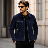 Man wearing navy blue suede jacket with black pants
