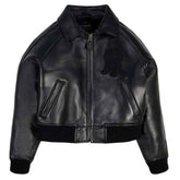 A black leather bomber jacket with a front zipper, ribbed knit collar, cuffs, and hem, featuring a tonal black embroidered patch on the left chest. The brand name 'VIVERES' is visible on the inner neck label.