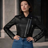 Women's black cropped studded leather motorcycle jacket, front view