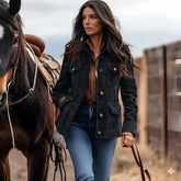 Woman wearing black suede jacket with jeans outdoors