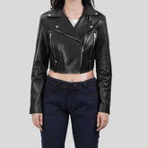 Woman wearing cropped black leather biker jacket with jeans