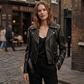 Women's black studded leather biker jacket with silver rivets, front view