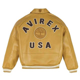 A tan leather jacket shown from the back, featuring 'AVIREX USA' and a tree emblem in dark brown and white embroidery.