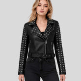 Women's black silver studded leather biker jacket front view — square silver studs on lapels and asymmetrical zipper closure