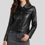 Women's black studded leather shirt jacket front view — golden stud collar and snap button closure