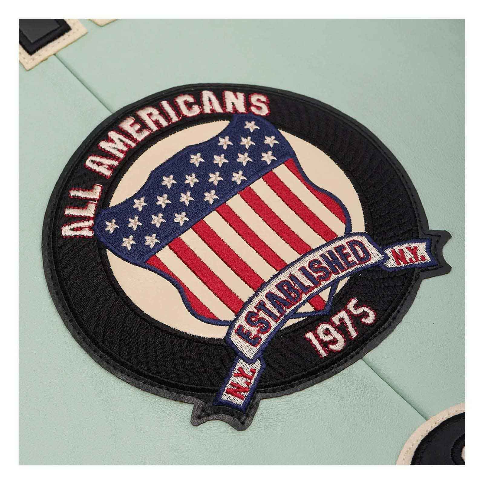 A circular embroidered patch featuring an American flag design with the text 'ALL AMERICANS' and 'ESTABLISHED N.Y.