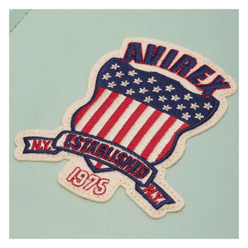 An embroidered patch featuring a shield design with red and white stripes, white stars on a blue field, and the text 'ANIREX' and 'N.Y.