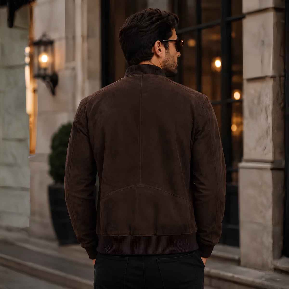 Back view of men's brown suede bomber jacket