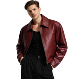 Man wearing burgundy leather jacket with black pants