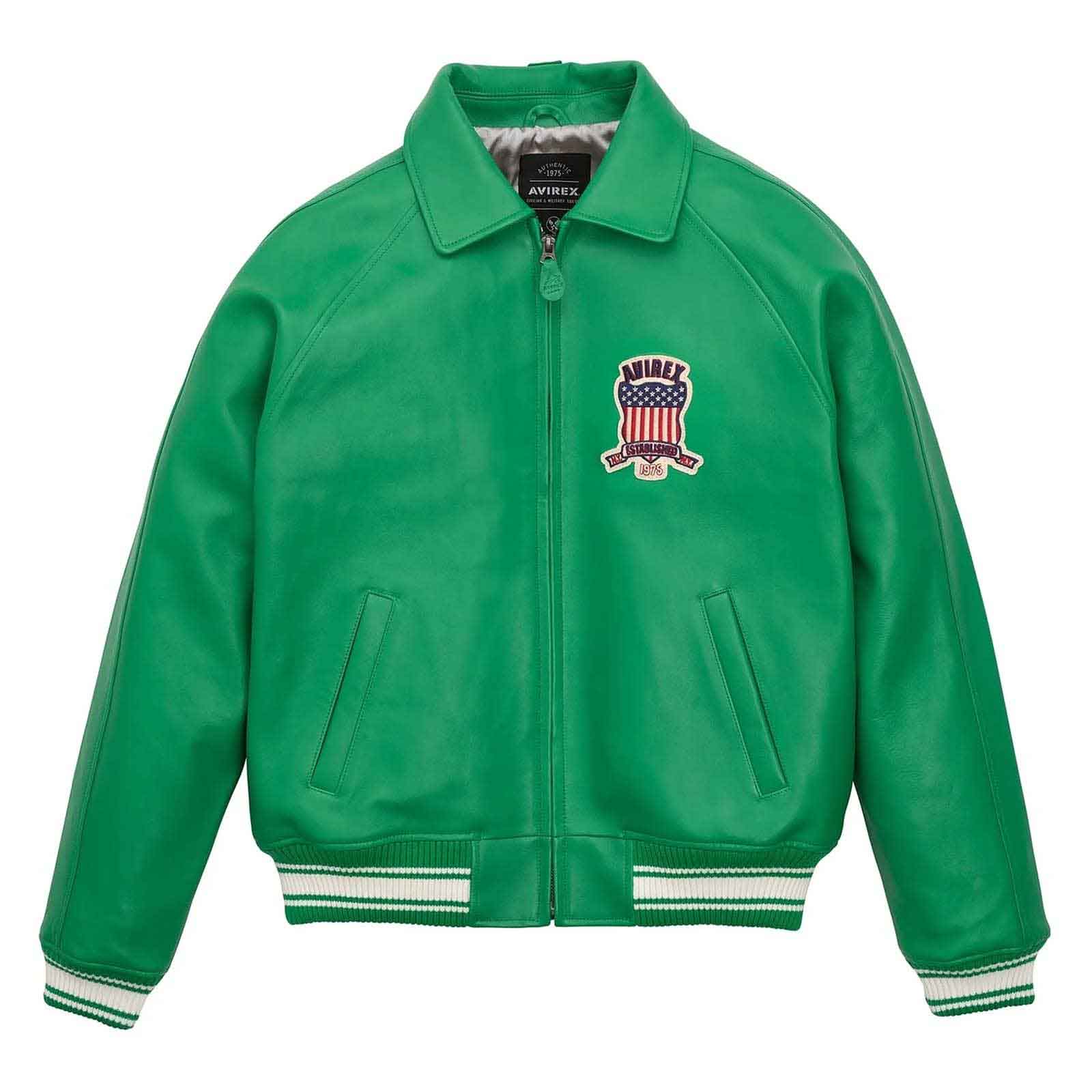 A green leather varsity-style jacket with a zip-up front, ribbed collar, cuffs, and hem, featuring a US flag crest patch on the left chest with the brand name 'MIRAE' and 'NEW YORK' embroidered on it. The jacket is displayed flat against a solid white background.