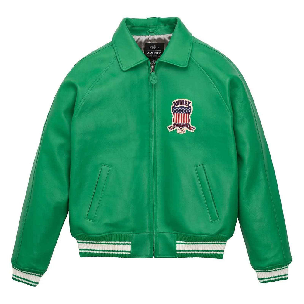 A green leather varsity-style jacket with a zip-up front, ribbed collar, cuffs, and hem, featuring a US flag crest patch on the left chest with the brand name 'MIRAE' and 'NEW YORK' embroidered on it. The jacket is displayed flat against a solid white background.