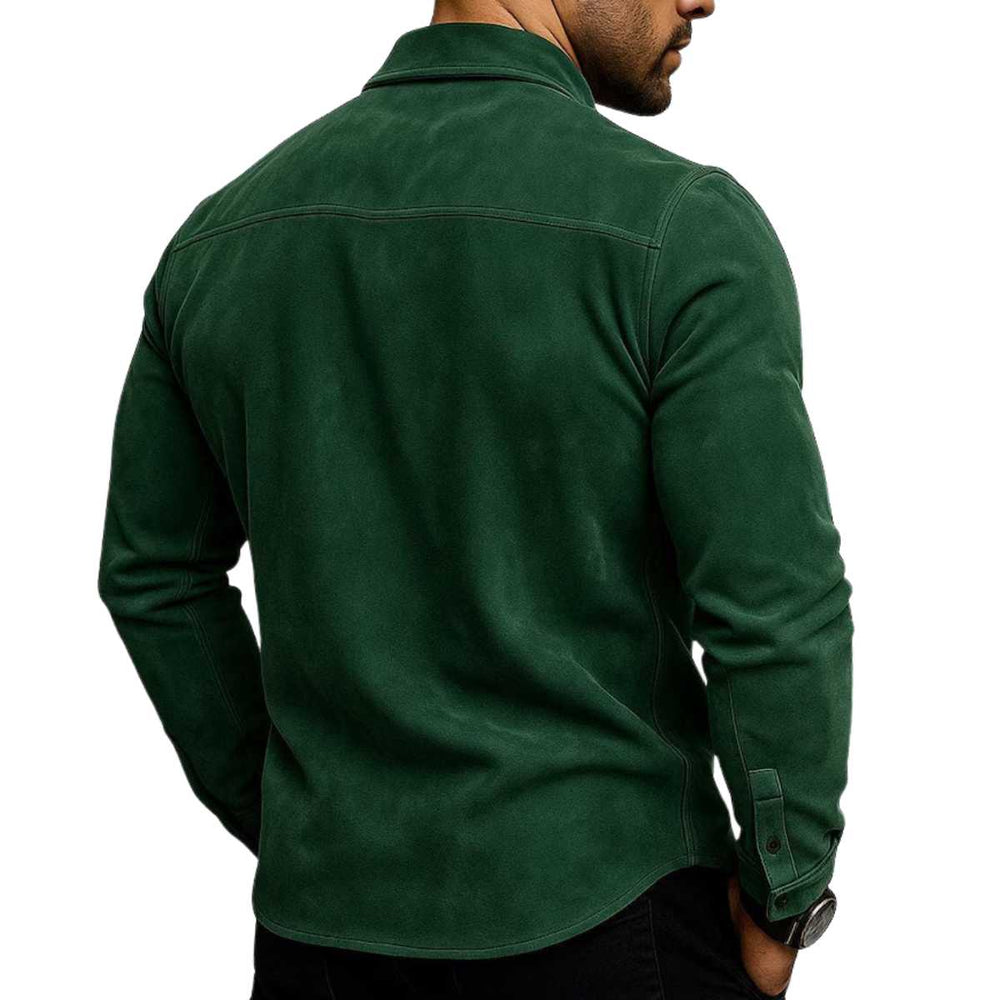 A man wearing a dark forest green long-sleeve shirt, shown from the back against a plain white background.