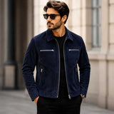 Man wearing navy blue suede jacket with black pants