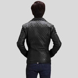 Side profile of studded motorcycle jacket showing asymmetrical zipper