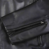 up: Close-up of zip chest pocket on black leather jacket