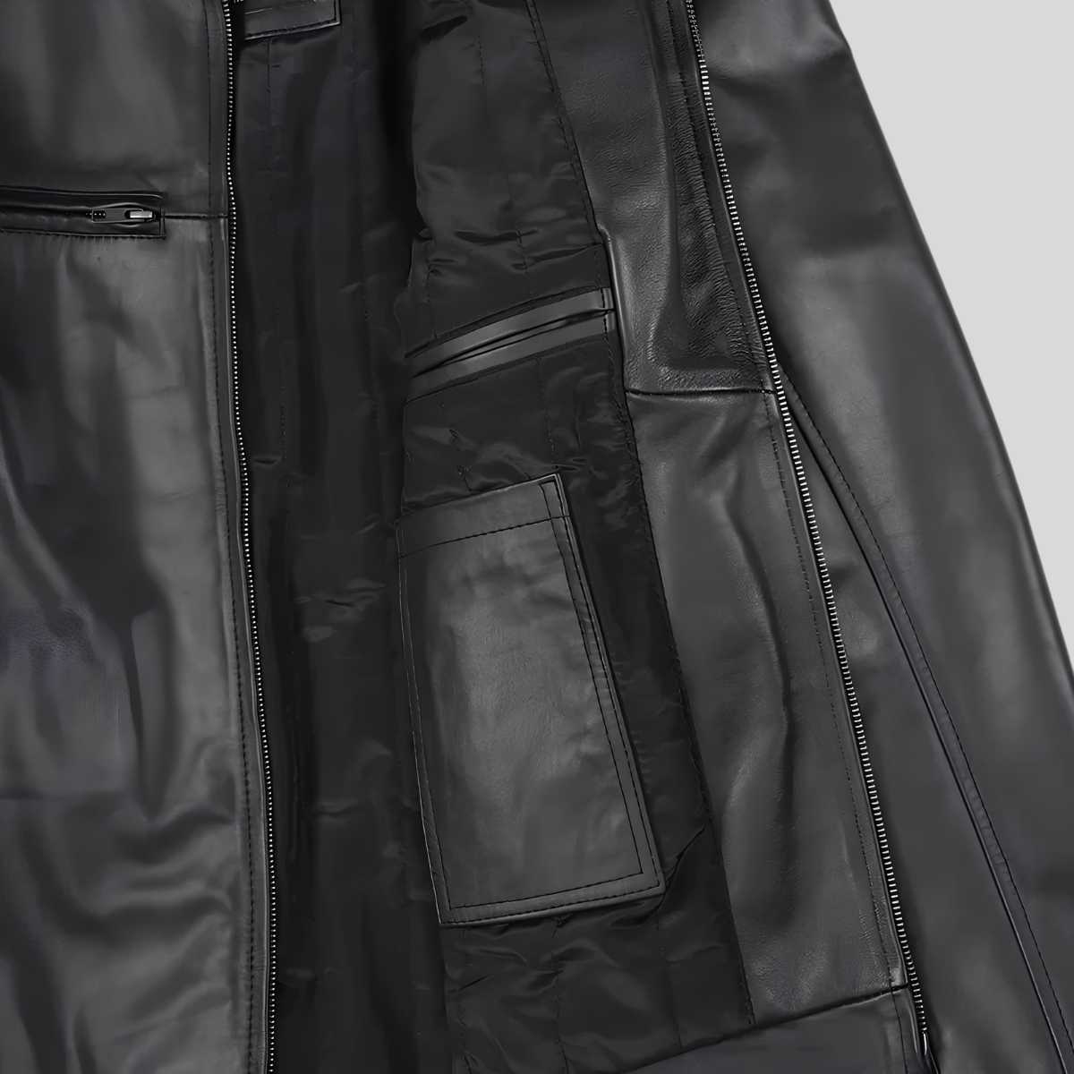 Close-up of a black leather jacket showing the interior lining, zippered pockets, and smooth leather panels against a light gray background.
