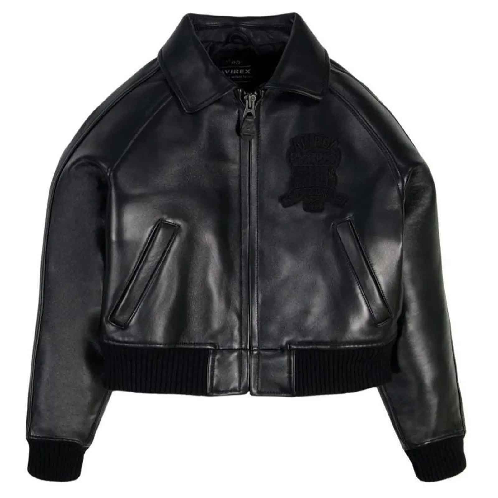 A black leather bomber jacket with a front zipper, ribbed knit collar, cuffs, and hem, featuring a tonal black embroidered patch on the left chest. The brand name 'VIVERES' is visible on the inner neck label.