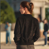 Back view of women's fitted suede bomber jacket