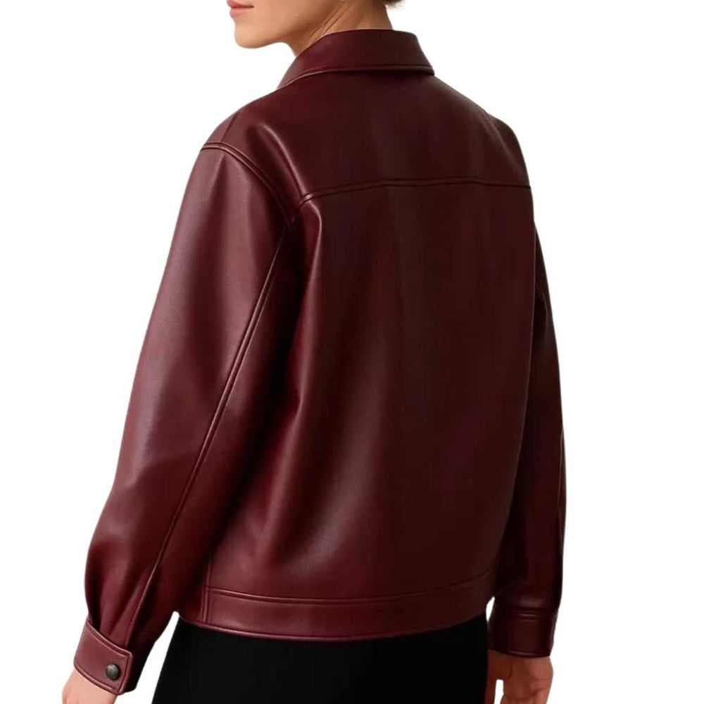 Women's burgundy leather jacket styled with white fitted top and black skirt — casual everyday outfit