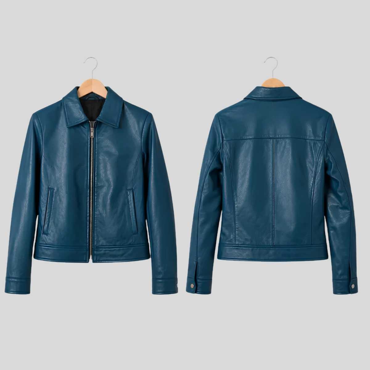 A dark teal blue faux leather jacket shown from both the front and back views, hanging on wooden hangers against a solid light gray background.