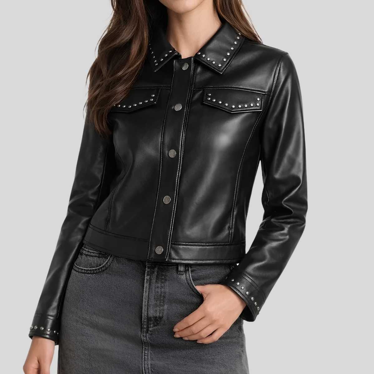 Women's black studded leather shirt jacket front view — golden stud collar and snap button closure
